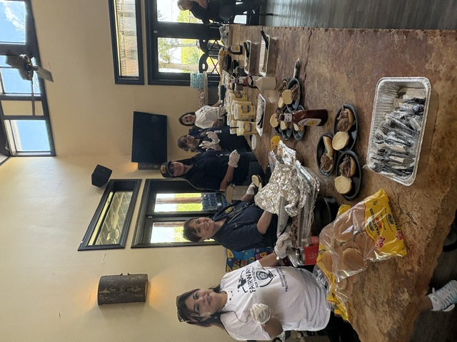 Volunteers serving lunch at the clubhouse